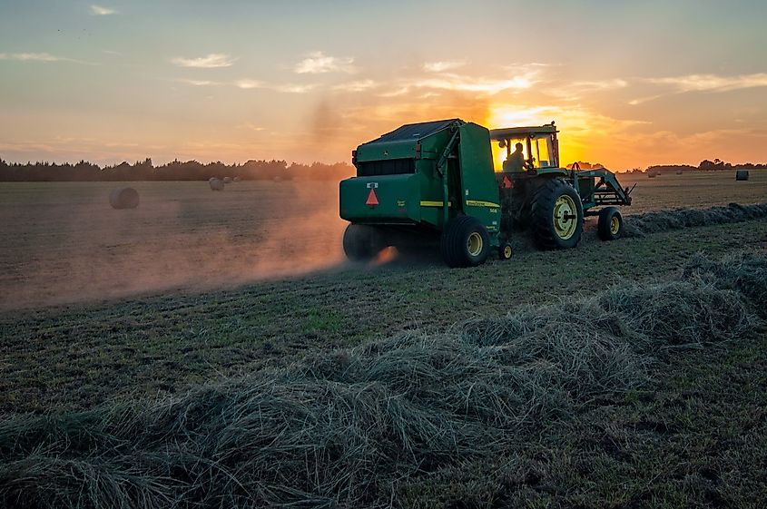 Green farm heavy equipment on green field (Image Credit: Jed Owen via Unsplash.com)