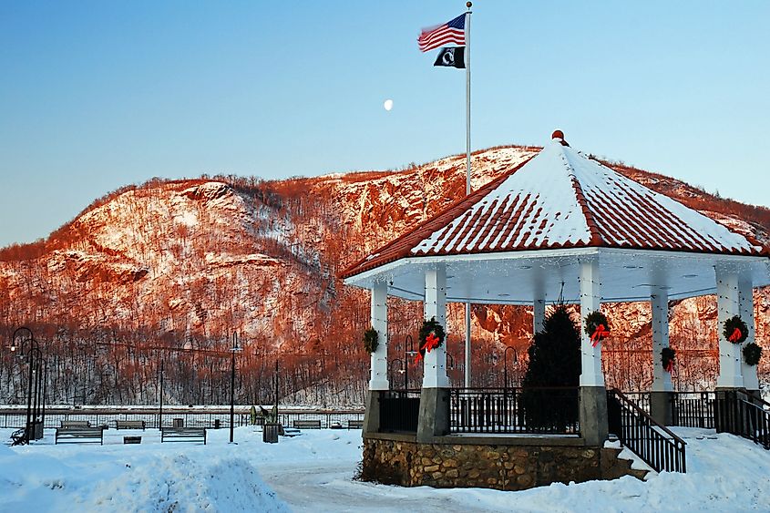 A gazebo sits at the Hudson River waterfront in Cold Spring, New York, all decorated for the Christmas holidays
