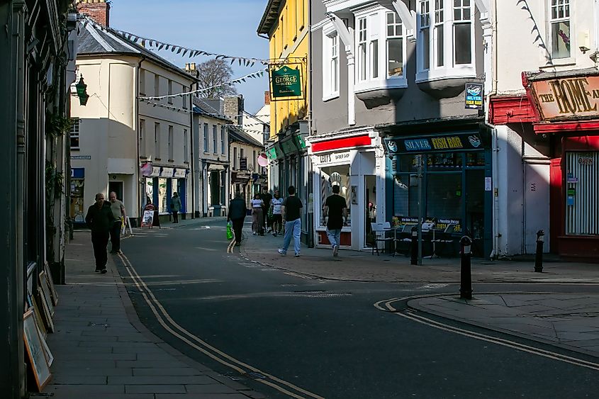 Shoppers in the winding streets of old Brecon Town in Wales