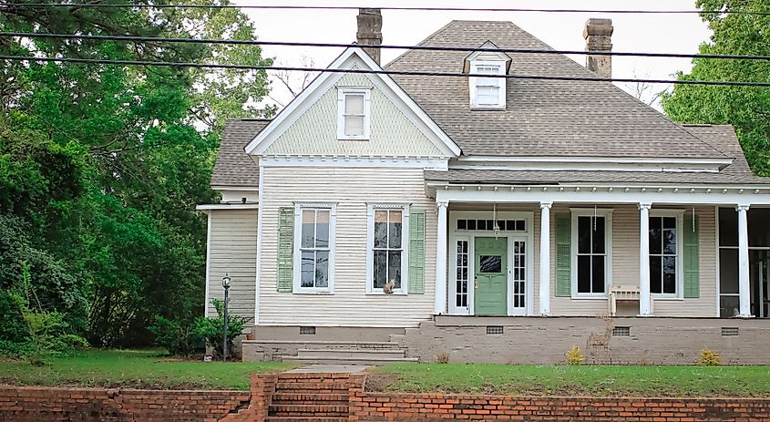 A Historic home with a cat by the window in Abbeville, Alabama