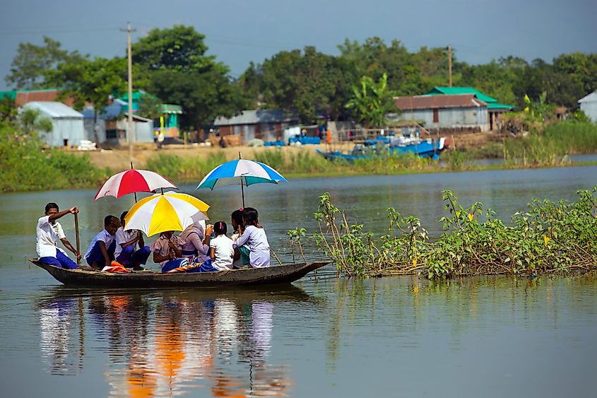 School students from remote villages affected by flood but still going to school by boat in Taherpur, Bangladesh