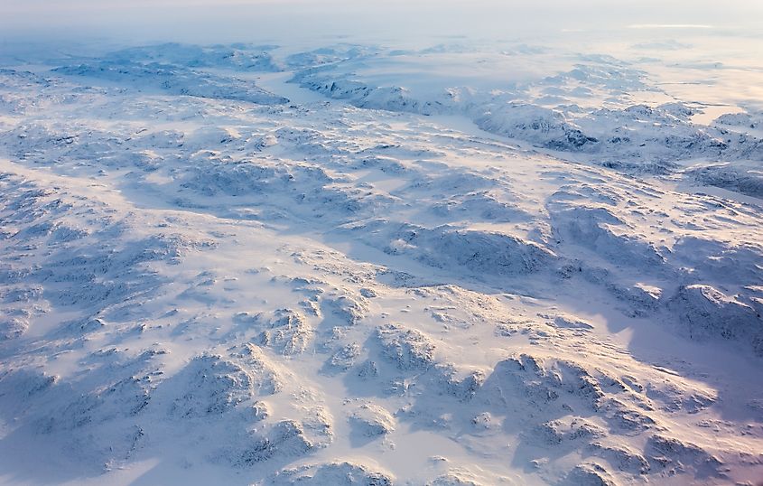Greenlandic ice cap with frozen mountains and fjords aerial view, near Nuuk, Greenland