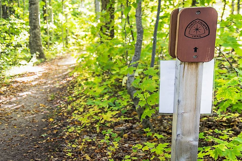  Trail marker on the North Country Trail as it passes through the forest of Pictured Rocks National Lakeshore. Editorial credit: ehrlif / Shutterstock.com