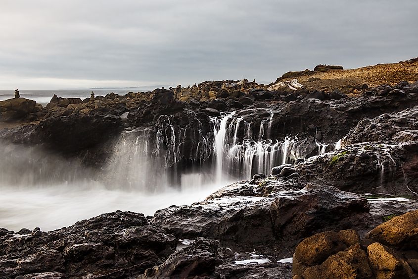 Black basalt rock forming the coastline in Yachats, Oregon.