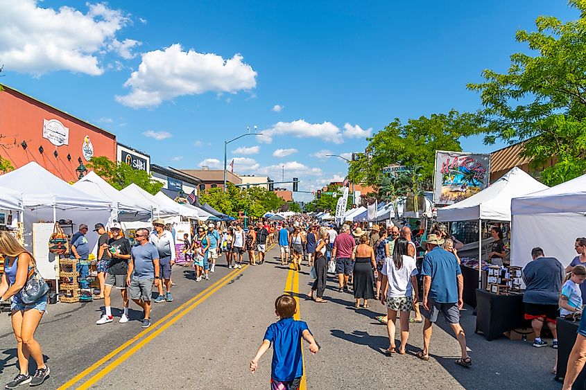 The annual Arts and Crafts Street Fair with vendors selling food, gifts and art products along main street Sherman Avenue, and through city park in the lakefront tourist resort town of Coeur d'Alene, Idaho.