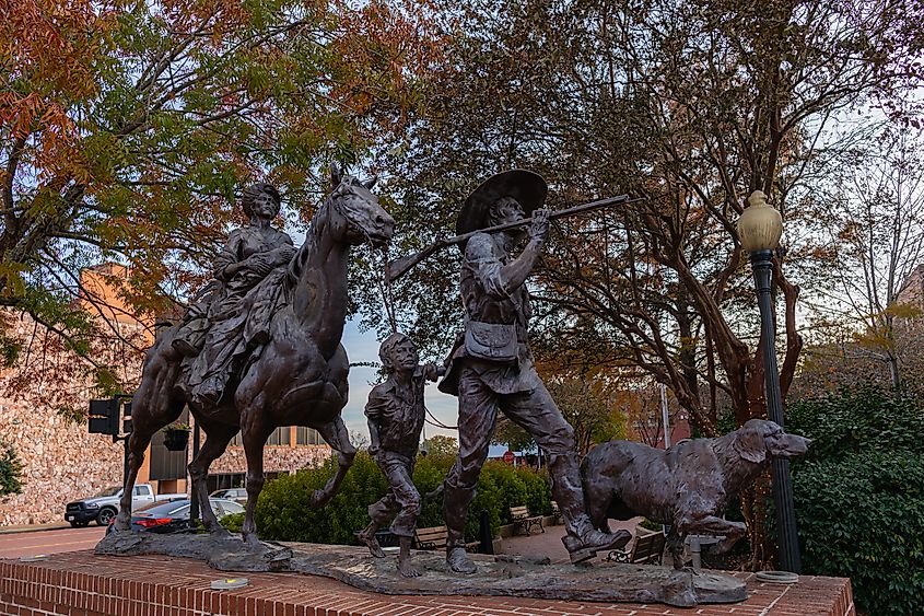 The Gateway statue by Michael Boyett, honoring the first settlers of Texas, in Nacogdoches, Texas. Editorial credit: Roberto Galan / Shutterstock.com.