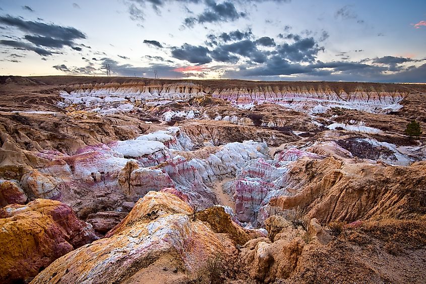 Paint Mines Interpretive Park in Calhan, Colorado, with colorful rock formations glowing in the light of sunset