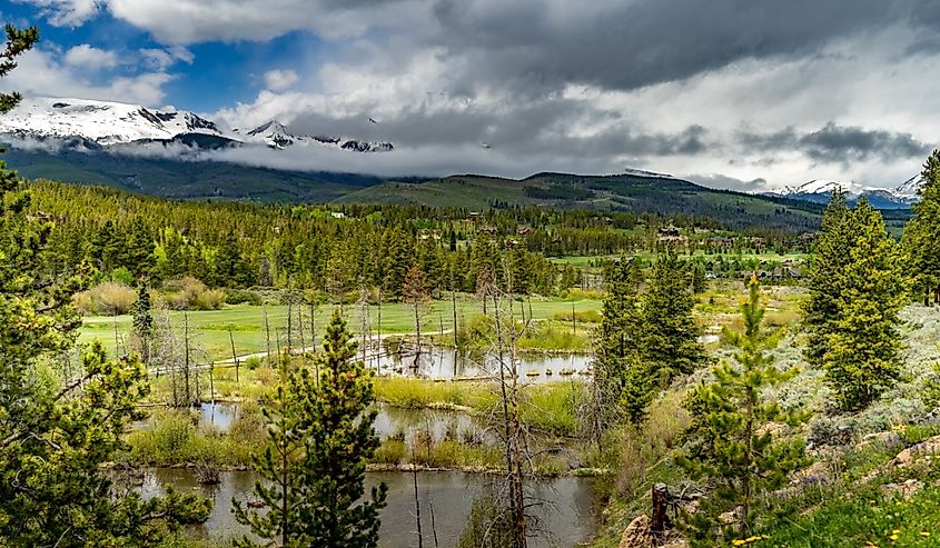 Looking over the Breckenridge Golf Club to the snow-capped 10 mile range during a springtime storm.