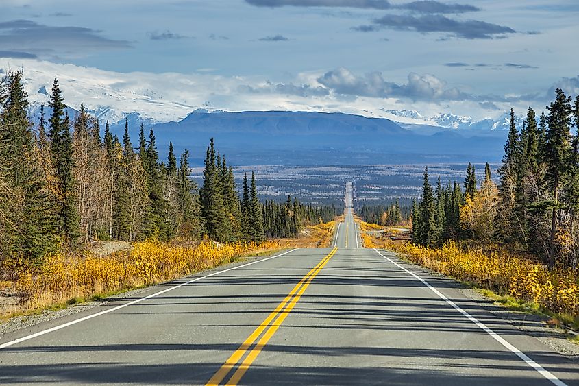 Warm colors of fall on Edgerton Highway to Chitina. Wrangell Mountains in the background. Alaska (Credit: Tomasz Wozniak via Shutterstock)