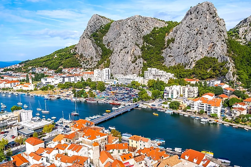 The Cetina River flows through Omiš, Croatia, framed by cliffs.