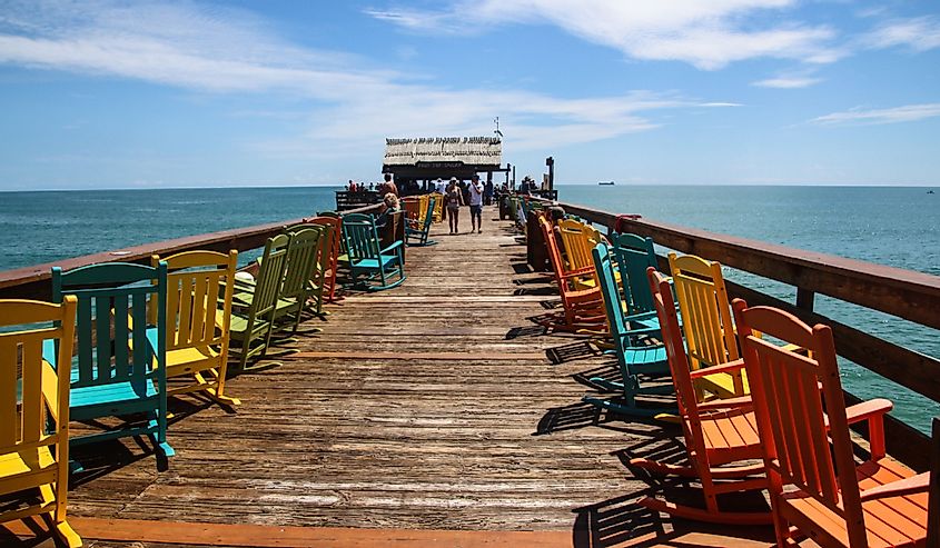 View of Cocoa Beach pier and its colorful chairs