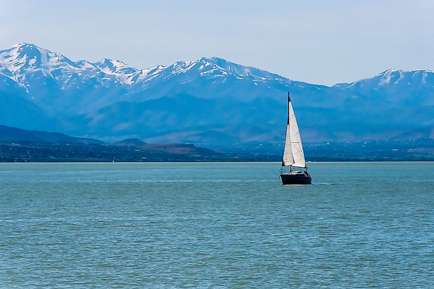 A sail boat anchored in the middle of Utah Lake in Provo, Utah