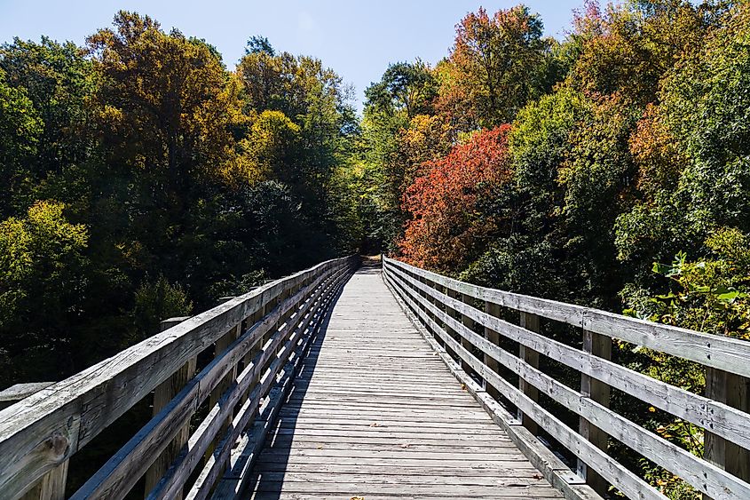 Abingdon, Virginia: Wooden bridge in an autumn forest along The Virginia Creeper National Recreation Trail.