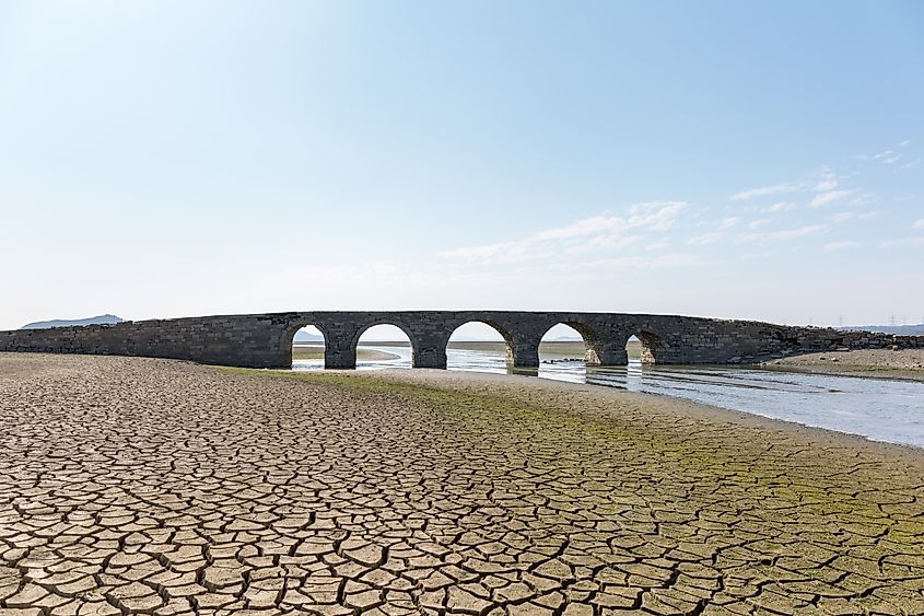 Ancient Ming dynasty stone bridge revealed in Poyang Lake during the dry season drought, Jiangxi province, China.