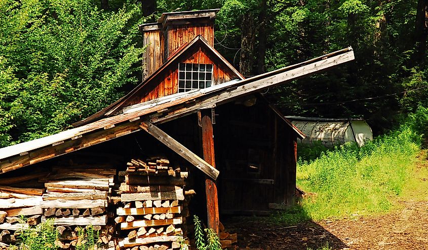 A rustic sugar house in Wilmington, Vermont stocks up on oven wood for the winter maple syrup season