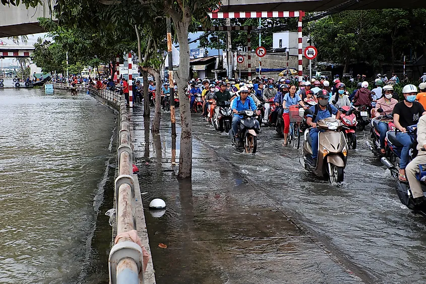 Editorial credit: xuanhuongho / Shutterstock.com. Flooded streets in Ho Chi Minh City, Vietnam.