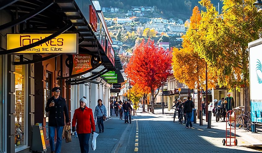 Queenstown, New Zealand, People and the town after sunset.