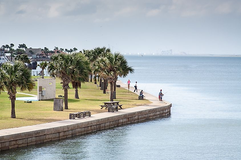 People fishing along the beautiful waterfront at Port Aransas, Texas.