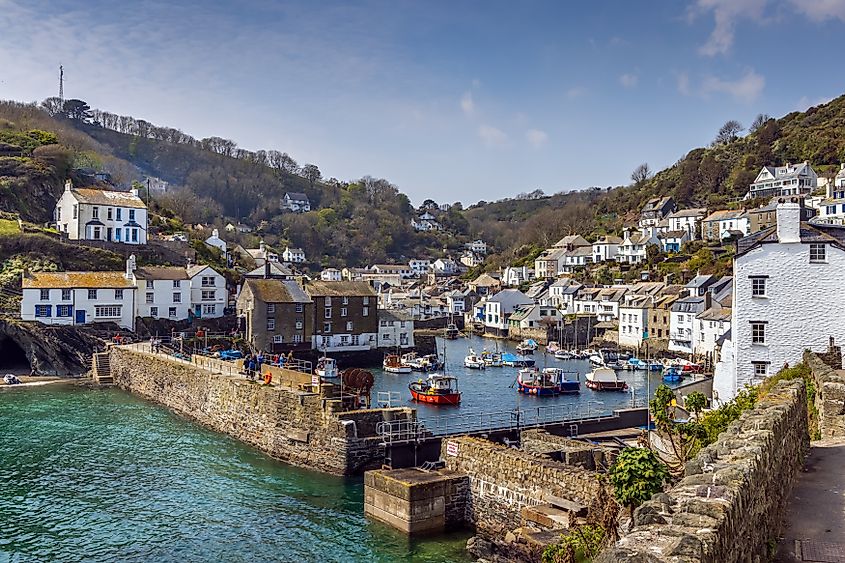 Entrance to the historic fishing harbour of Polperro on a summer day in Cornwall, England