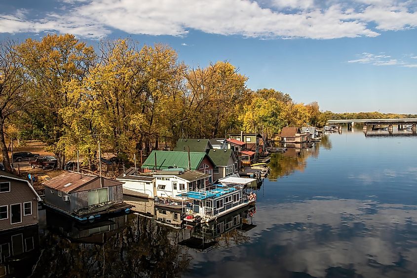 Winona, Minnesota USA October 12, 2022 Houseboats on Latsch Island in the backwaters of the Mississippi River on an autumn morning, taken from the Latsch Island Bridge in Winona, Minnesota USA.