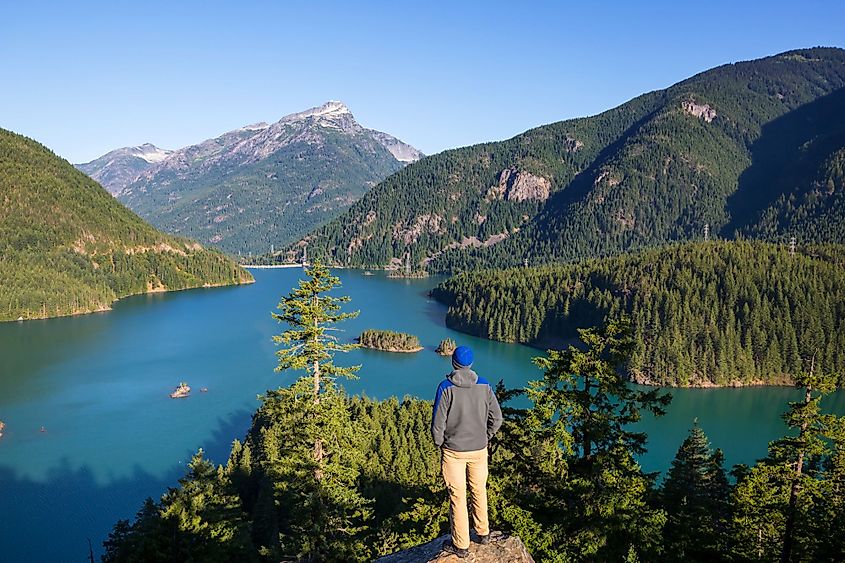 A hiker viewing Diablo Lake in North Cascades National Park, Washington.