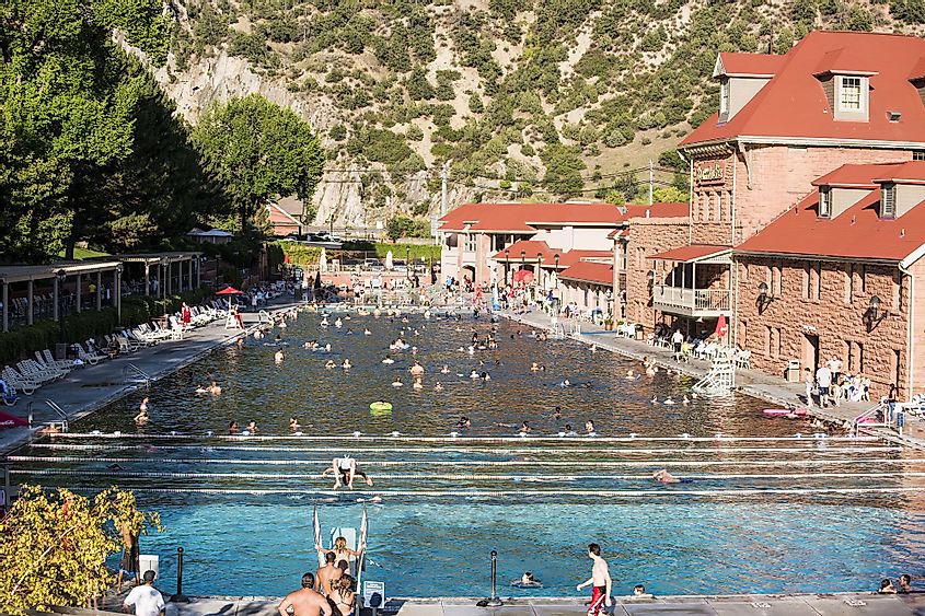 People bath at public hot springs pool in Glenwood Springs, Colorado
