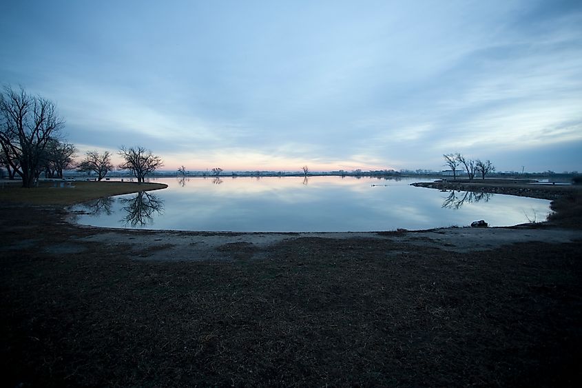 A clear, spring-fed lake at Artesian Beach Park not far from Shattuck.