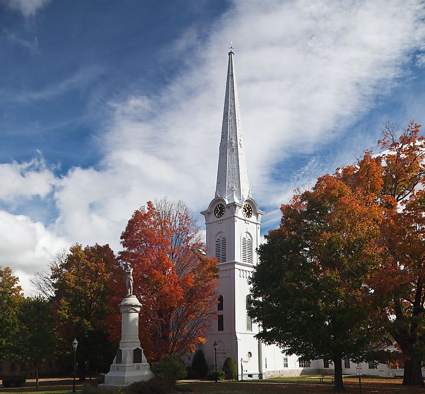 Main Street of Manchester, Vermont, USA, in Autumn with Bright Orange and Red Trees.