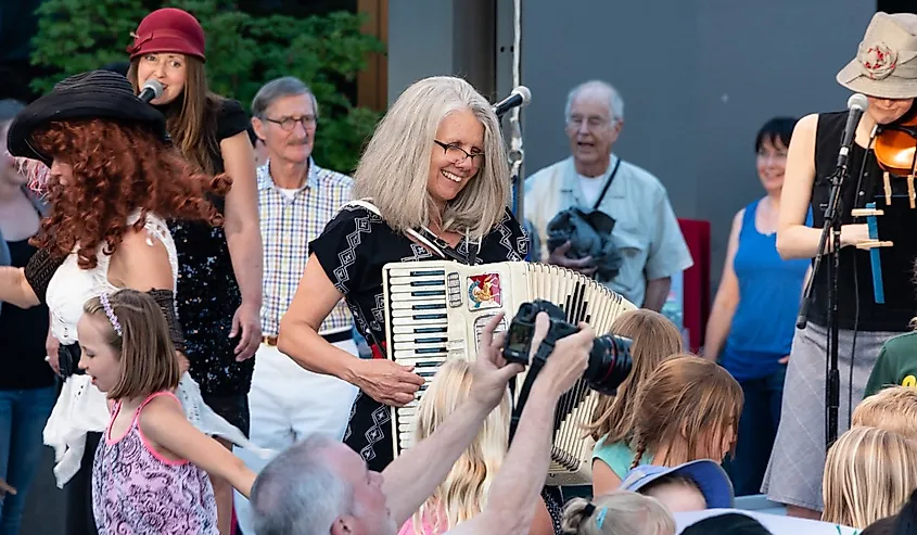 Stephany Smith Pearson of the Bathtub Gin Serenaders performs for the free, outdoor "Green Show," held six nights a week at the Oregon Shakespeare Festival. Ashland, Oregon.