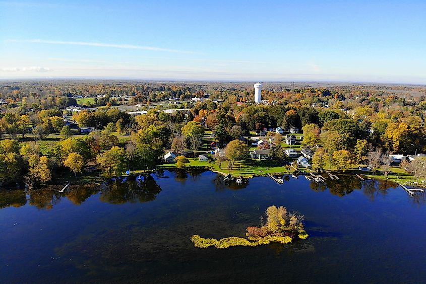 The aerial view of the waterfront residential area by Oneida Lake with stunning fall foliage near Syracuse, New York