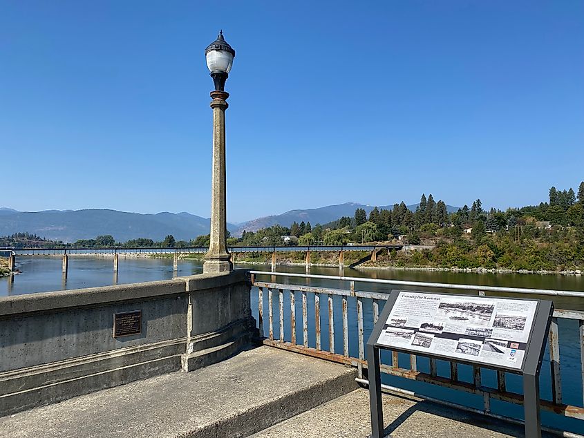 A riverside interpretive sign explaining the origins of Bonners Ferry, Idaho