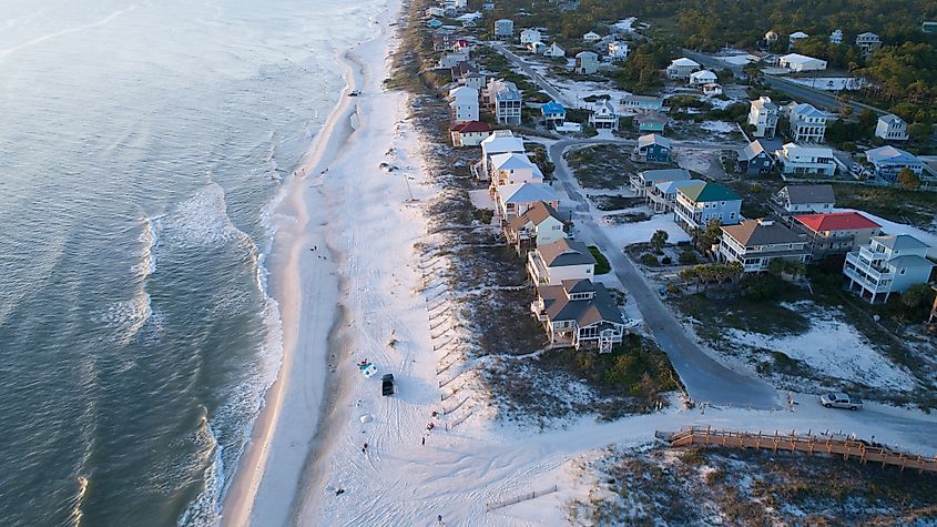 The white sandy beach and beach homes in Cape San Blas, Florida.