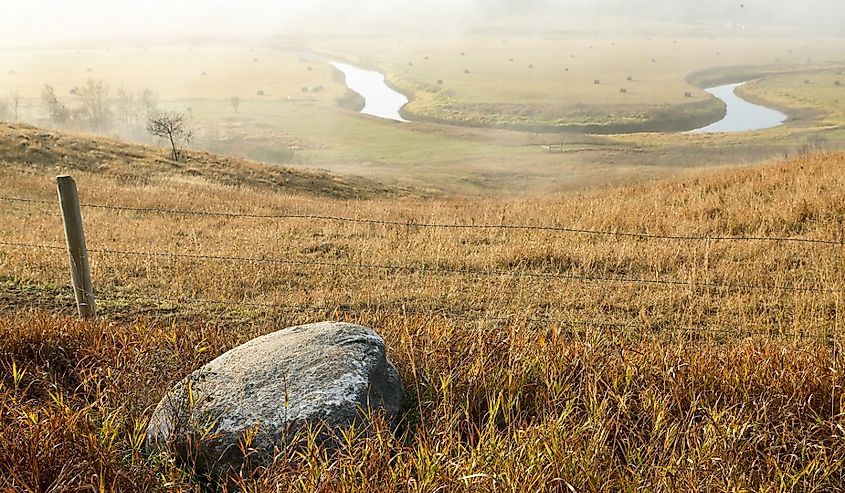 Misty North Dakota landscape with a horse shoe bend of the Sheyenne River.