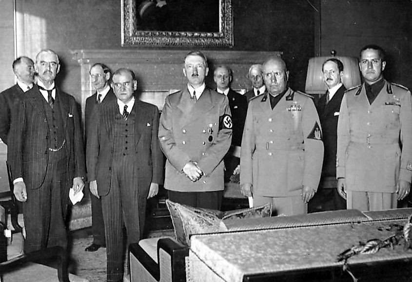 From left to right: Neville Chamberlain, Édouard Daladier, Adolf Hitler, and Benito Mussolini pictured before signing the Munich Agreement (1938).