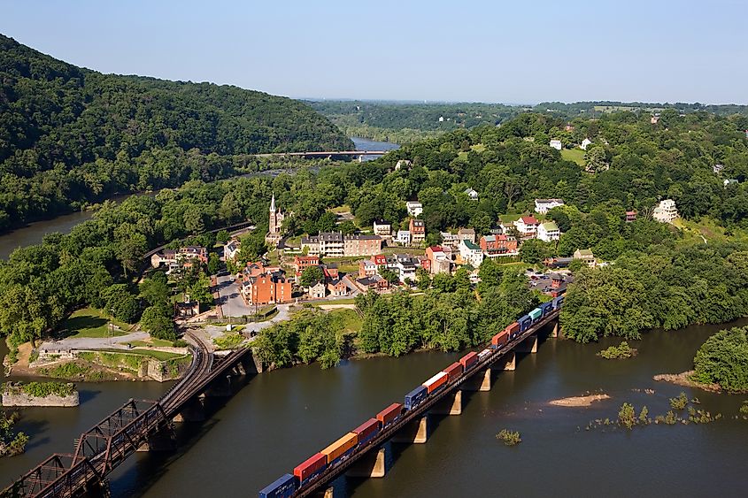 A train rolls across the Shenandoah River in an aerial view of the town of Harpers Ferry, West Virginia