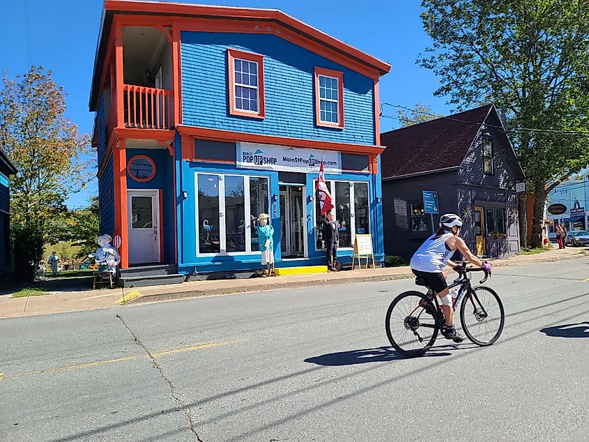 Mahone Bay, NS, CAN, September 25th, 2022 - A pair of scarecrows standing in front of a building during the Mahone Bay Scarecrow Festival. One is of Queen Elizabeth and the other of King Charles.