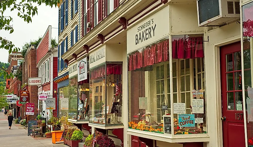 Shops, eateries, and baseball-themed attractions line the sidewalk on Main Street in Cooperstown, New York.