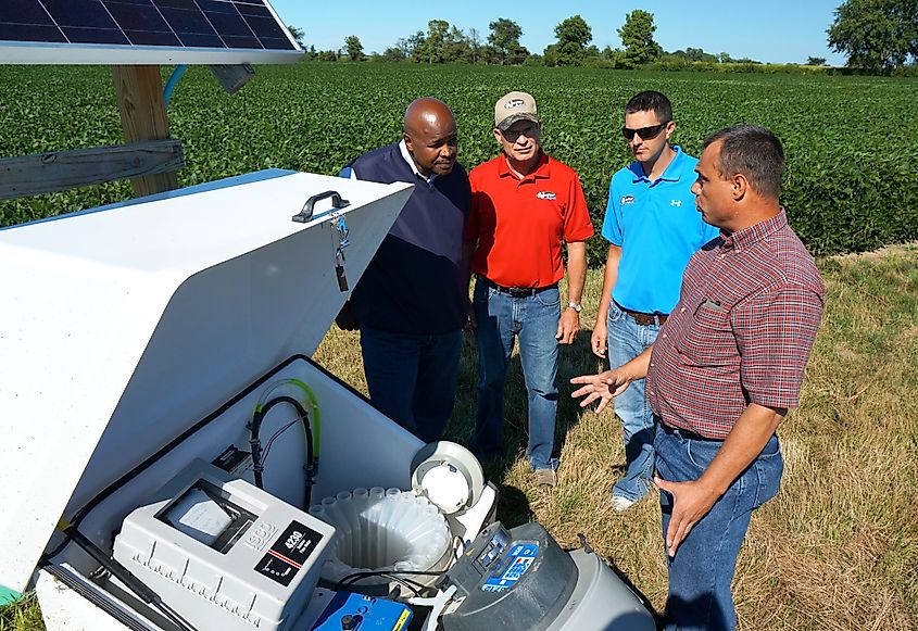 U.S. Department of Agriculture (USDA) Agricultural Research Service (ARS)engineer Kevin King (right) explains an edge of field water quality monitoring station to Ohio State Conservationist Terry Cosby