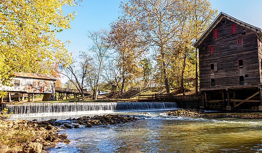 Historic mill and covered bridge on Talladega Creek at Kymulga Grist Mill and Park, Childersburg, Alabama.