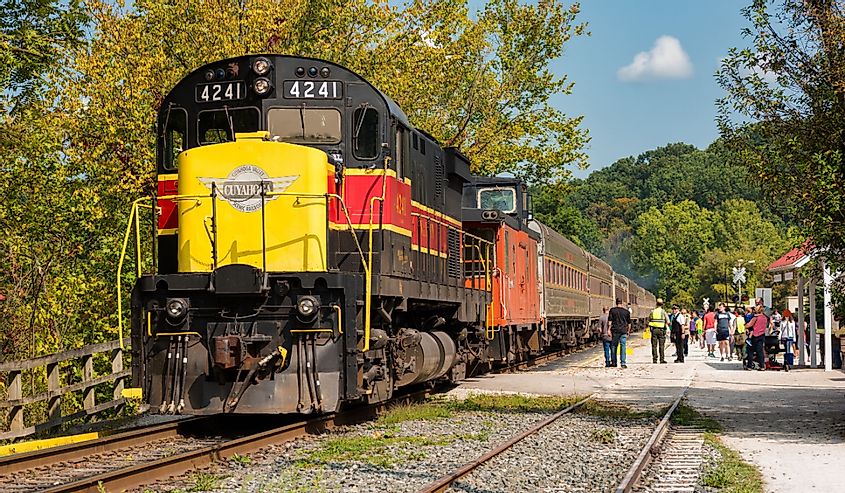 The scenic train stops to let passengers on and off at the station in Peninsula during its run on the Cuyahoga Valley Scenic Railroad.