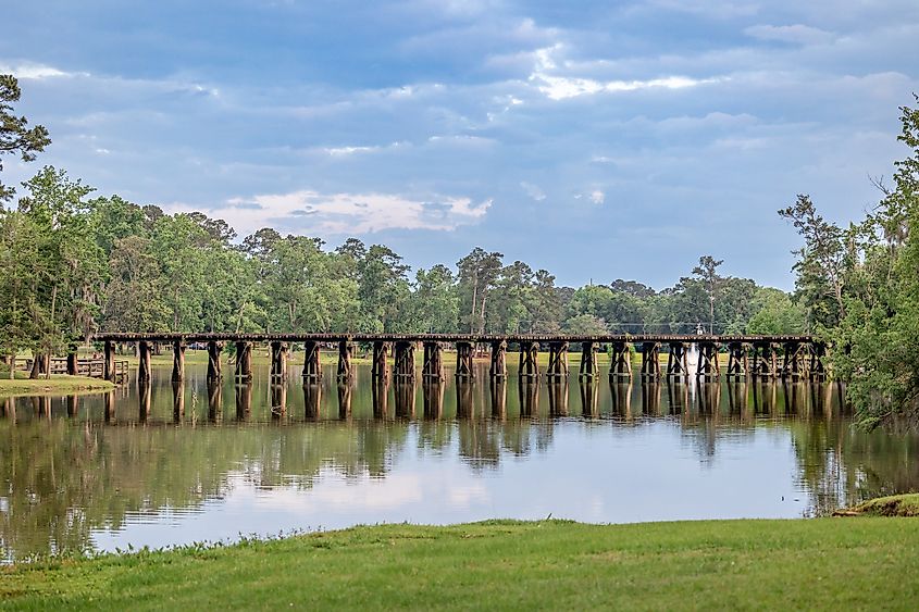 A railroad track bridge over the Cherokee Lake in Thomasville, Georgia.