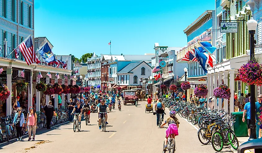 A busy day in downtown Mackinac Island, Michigan. Image credit: Michael Deemer via Shutterstock.com.