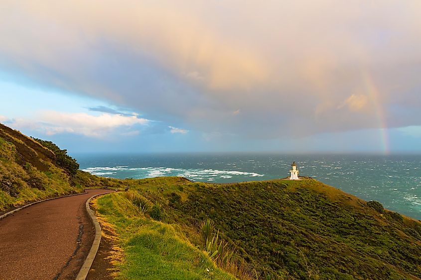 Rainbow above lighthouse cape reinga in New Zealand