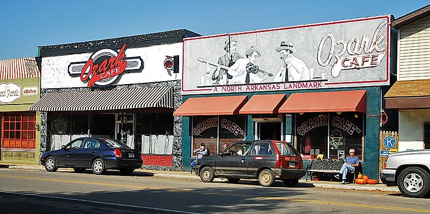 Historic downtown Jasper, Arkansas, featuring quaint buildings and shops along a tree-lined street.