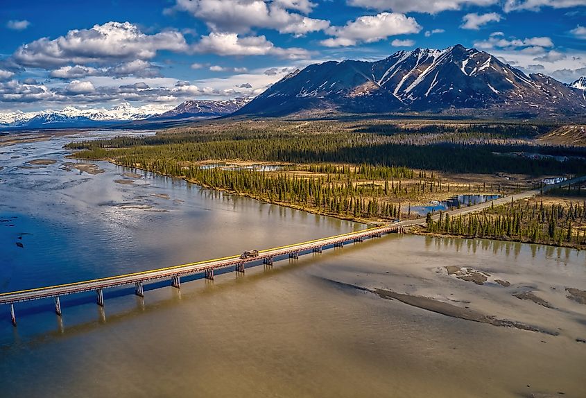 Aerial view of the Denali Highway winding across open country in Alaska.