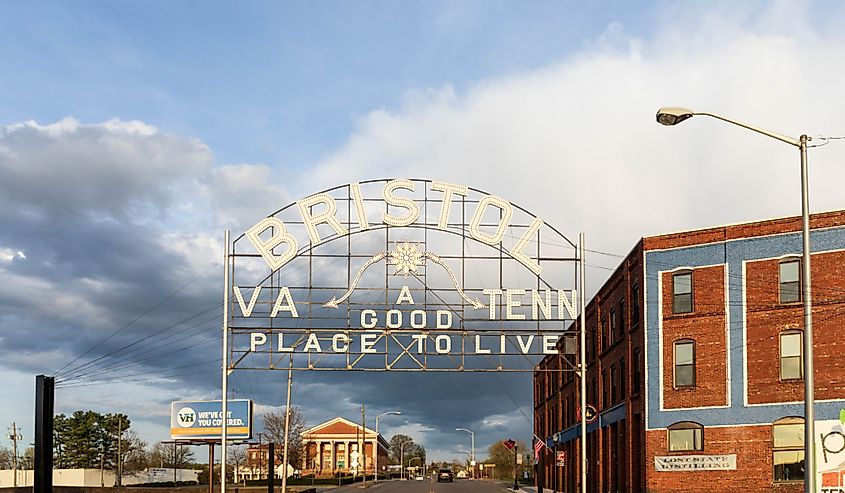 The Bristol Virginia-Tennessee Slogan sign, a landmark in the twin cities, is positioned over State Street at the railroad tracks. Dates from 1921.