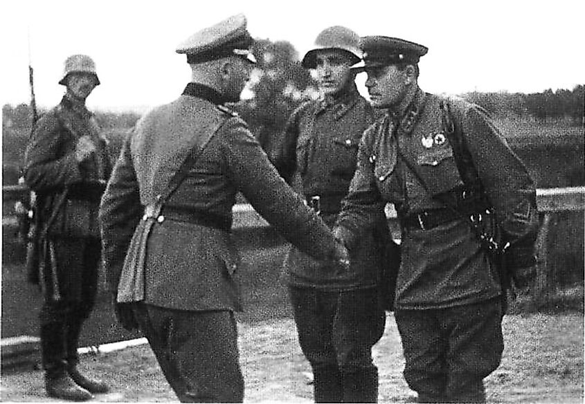 German and Soviet troops shaking hands following the invasion of Poland in September 1939.