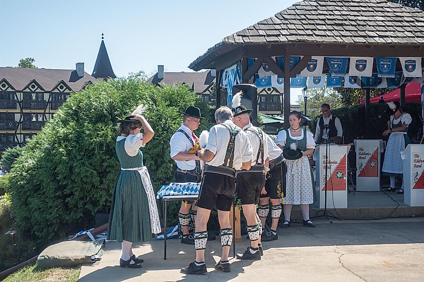 German musical band wearing traditional Bavarian costumes preparing for an Oktoberfest performance in Shepherdstown, West Virginia, USA.