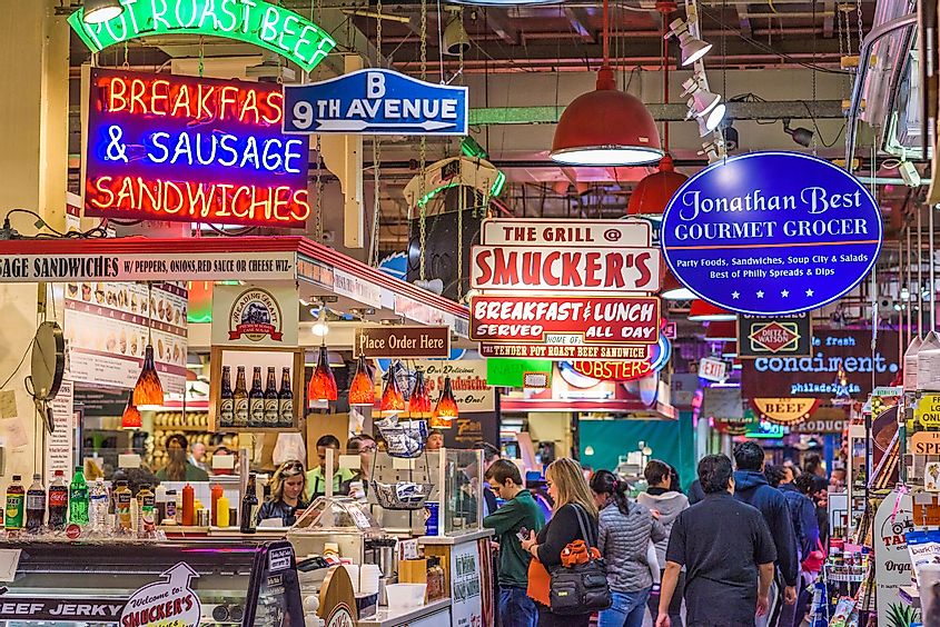 Vendors and customers in Reading Terminal Market. The historic market is a popular attraction for culinary treats, via Sean Pavone / Shutterstock.com