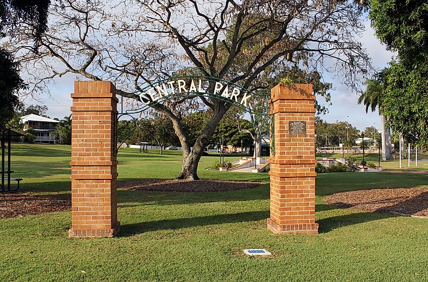 Brick pillars and metal arch at the entrance to Central Park (also known as Anzac Park) in Gladstone, Queensland, Australia.